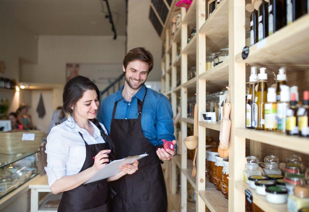 Two,Shop,Assistants,In,Package-free,Store,Using,Reusable,Containers,,Checking